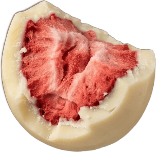 Cut open, a whole strawberry inside the white chocolate shell